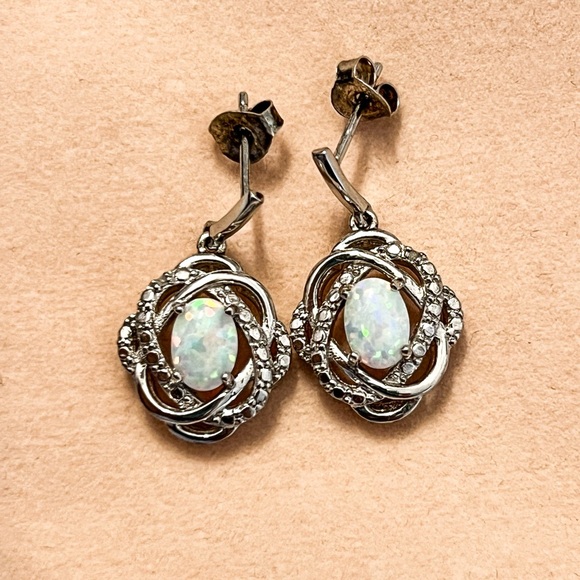 Lab created opals set in silver earrings. - Picture 5 of 6
